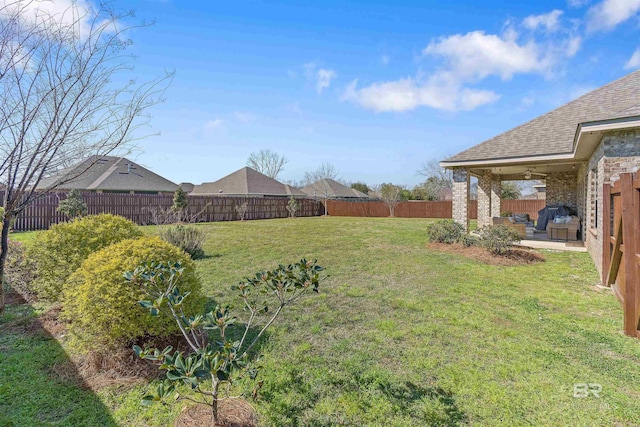 view of yard featuring a fenced backyard and a patio area