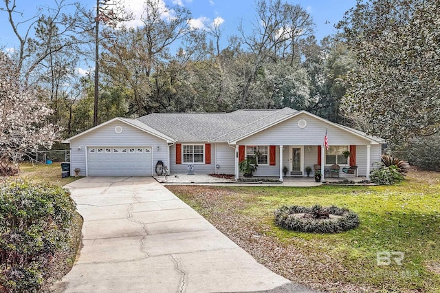 ranch-style home featuring a garage, a front yard, and covered porch