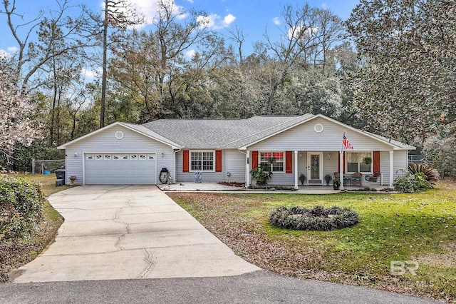 single story home with a garage, covered porch, and a front lawn