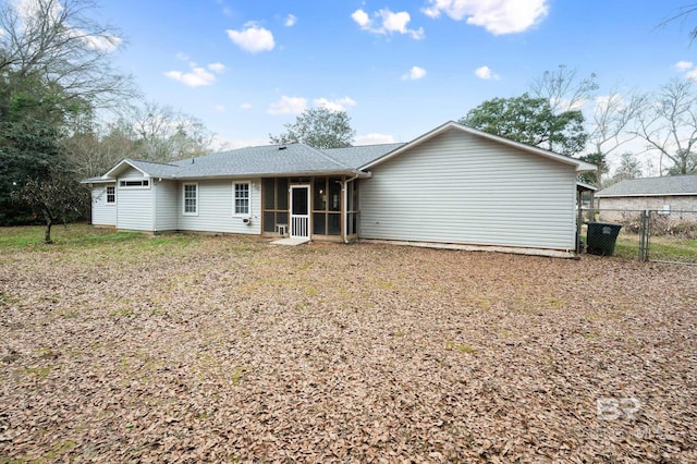 back of house featuring a sunroom