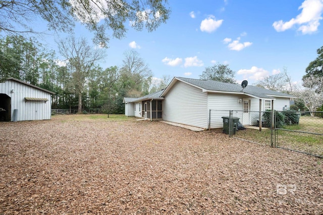 view of home's exterior featuring a garage and an outbuilding