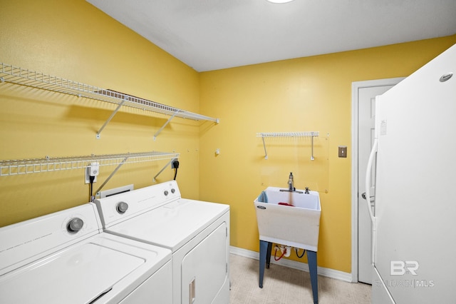 laundry area featuring washing machine and dryer