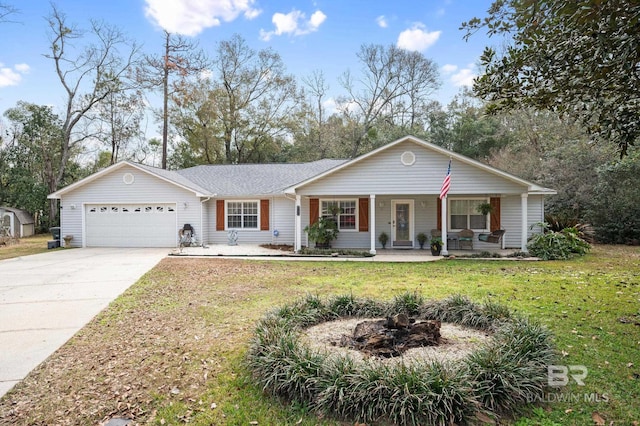 single story home featuring a garage, covered porch, and a front yard