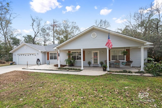 single story home with a porch, a garage, and a front lawn