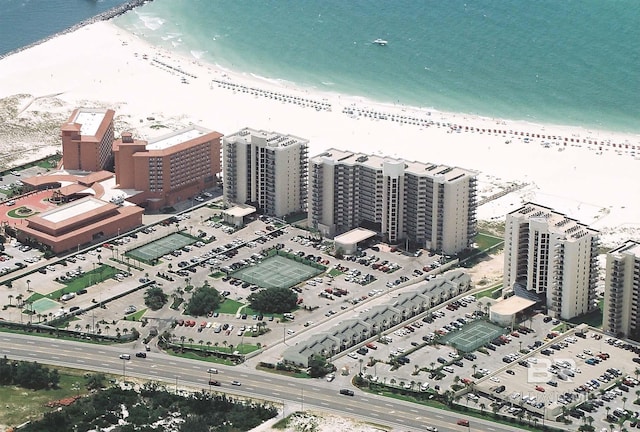 aerial view featuring a water view and a beach view