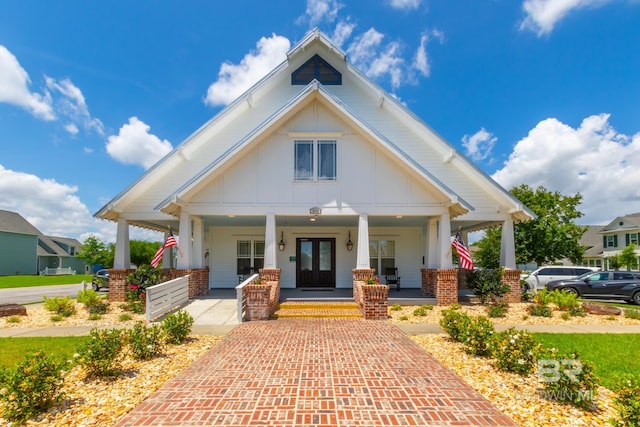 view of front of house featuring covered porch and board and batten siding