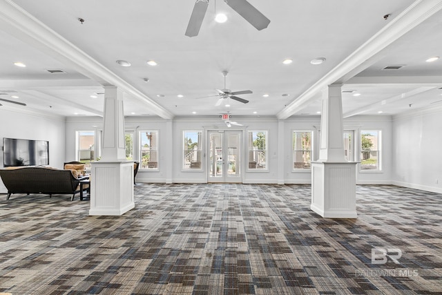carpeted living room with visible vents, baseboards, a ceiling fan, ornamental molding, and ornate columns