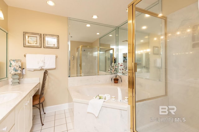 bathroom with tile flooring, shower with separate bathtub, and large vanity