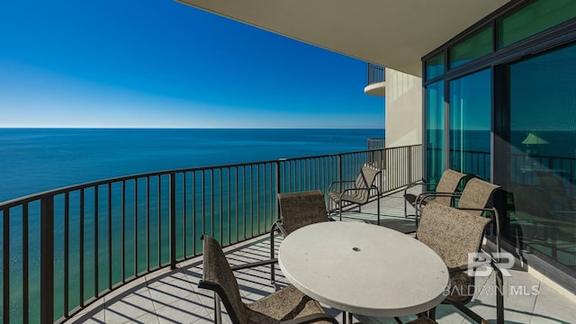 balcony featuring a water view