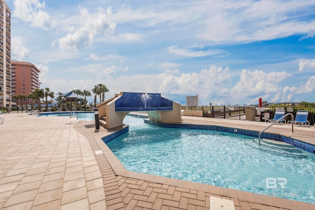 view of swimming pool featuring pool water feature