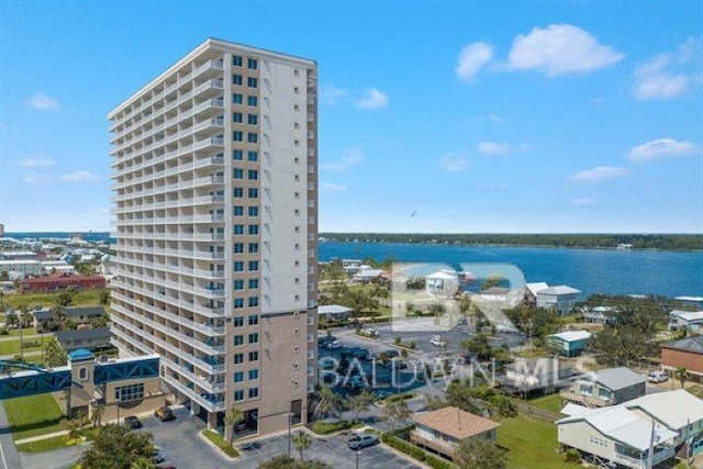 exterior space featuring a water view and a city view