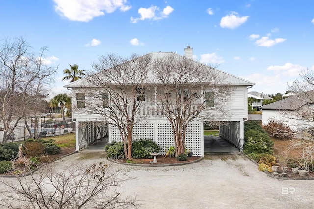 view of front of home featuring a carport