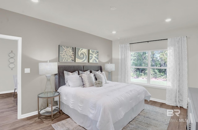 bedroom with hardwood / wood-style floors