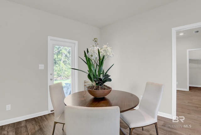 dining space featuring hardwood / wood-style floors