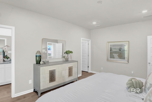 bedroom with dark wood-type flooring