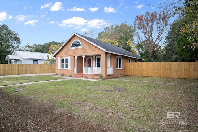 view of front of home featuring a porch and a front lawn