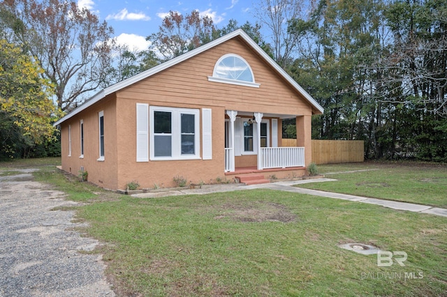 bungalow-style house with a porch and a front yard