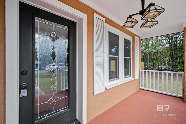 doorway to property with covered porch