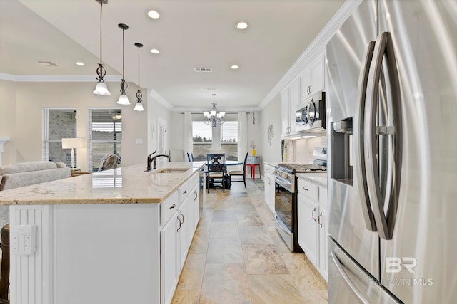 kitchen featuring a sink, visible vents, appliances with stainless steel finishes, decorative backsplash, and crown molding