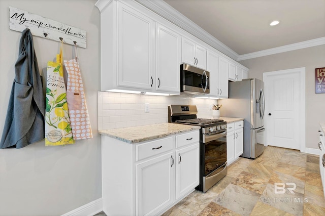 kitchen with crown molding, tasteful backsplash, appliances with stainless steel finishes, white cabinets, and baseboards