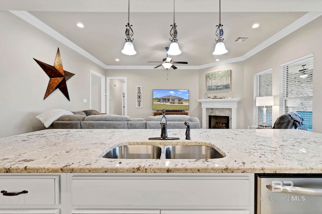 kitchen featuring light stone counters, visible vents, open floor plan, a sink, and dishwasher