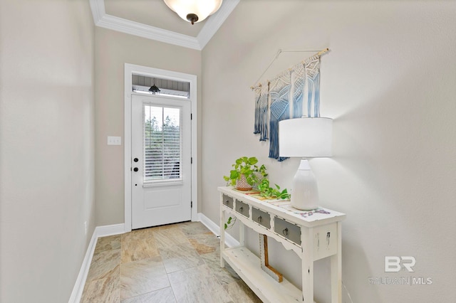 doorway featuring baseboards and ornamental molding