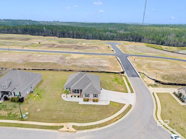 bird's eye view featuring a forest view