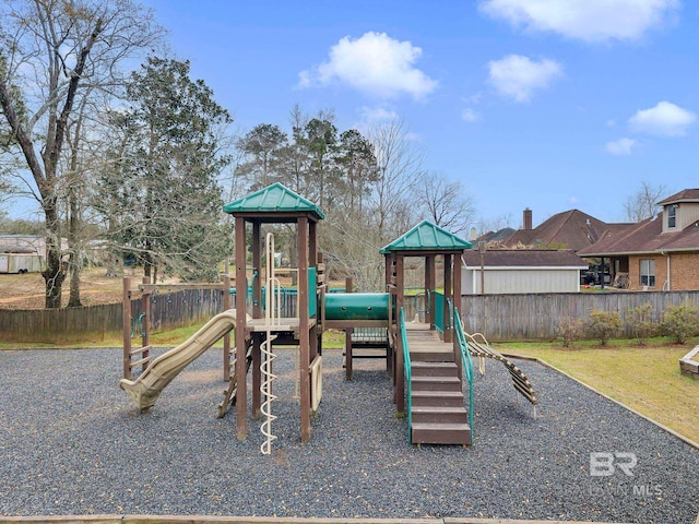 community jungle gym featuring fence