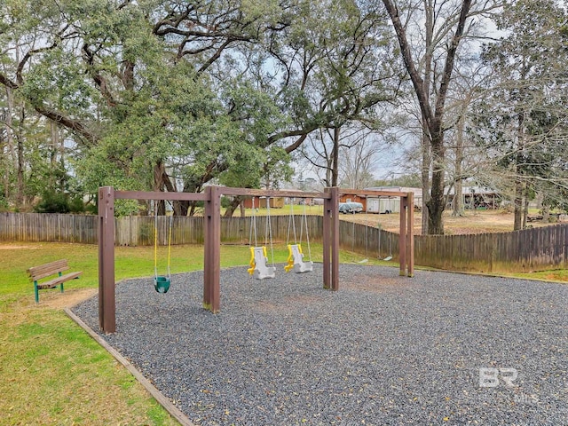 view of play area with a yard and fence