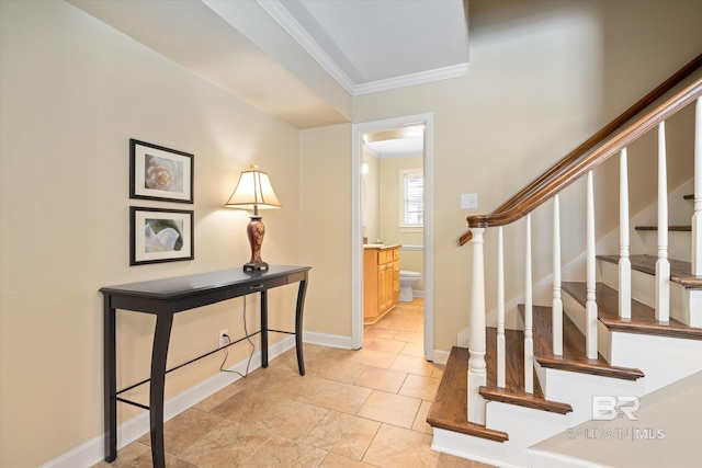 interior space featuring ornamental molding, stairway, and baseboards