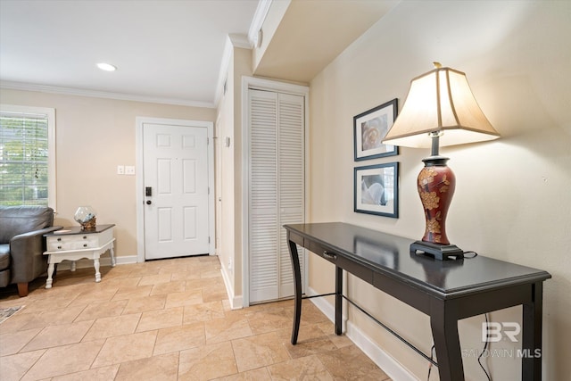 foyer featuring baseboards, ornamental molding, and recessed lighting