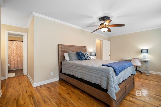 bedroom with light wood-style floors, ornamental molding, baseboards, and a ceiling fan