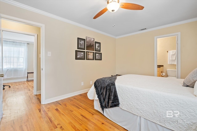 bedroom with ornamental molding, light wood finished floors, visible vents, and baseboards