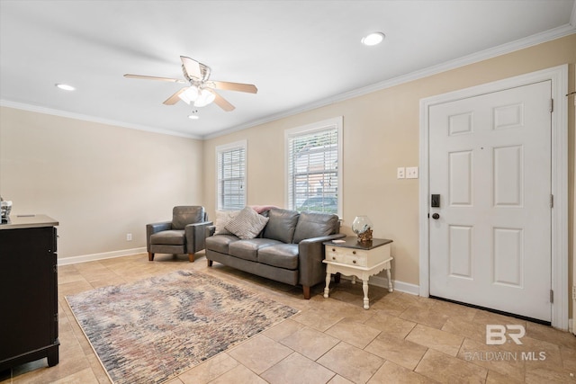 living room featuring baseboards, ornamental molding, and a ceiling fan