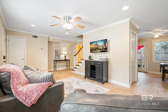 living area featuring visible vents, light tile patterned flooring, crown molding, and stairway