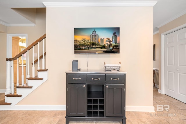 bar featuring stairway, baseboards, and crown molding