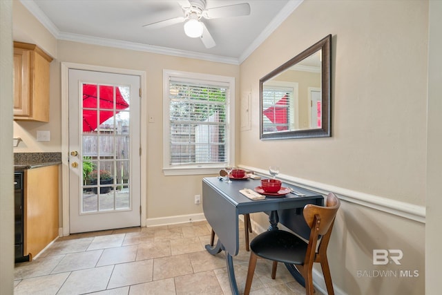 doorway with light tile patterned flooring, crown molding, baseboards, and ceiling fan