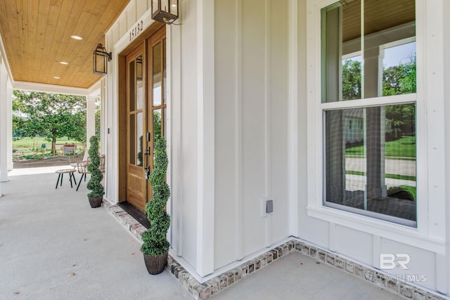 15132 Itea Dr, Foley, AL 36535 - view of exterior entry with a porch and board and batten siding