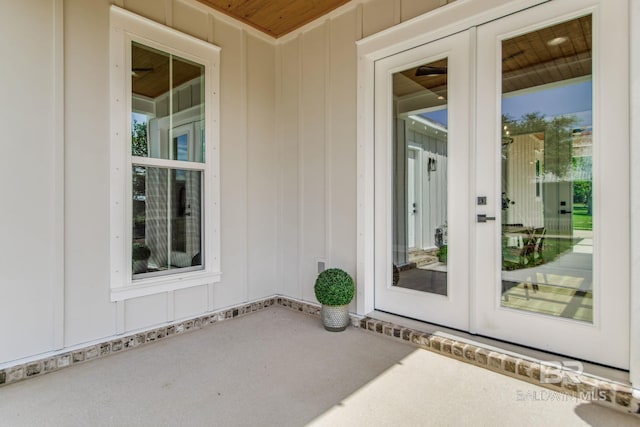 15132 Itea Dr, Foley, AL 36535 - property entrance featuring board and batten siding, a patio, and french doors