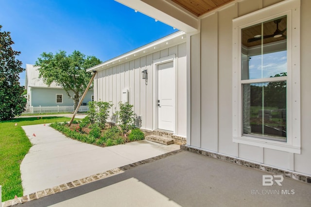 15132 Itea Dr, Foley, AL 36535 - doorway to property with board and batten siding and a patio area