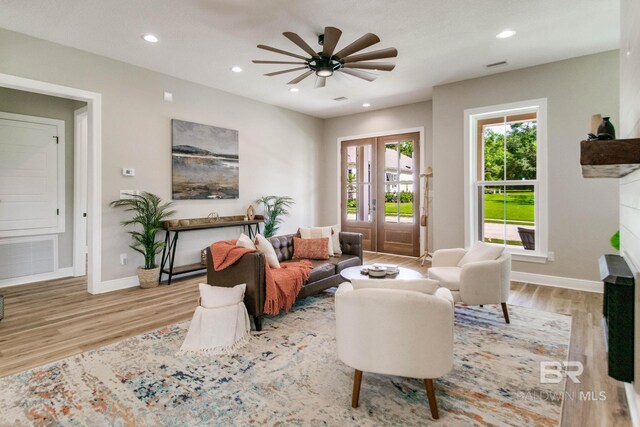15132 Itea Dr, Foley, AL 36535 - living room with wood finished floors, a ceiling fan, a fireplace, and recessed lighting