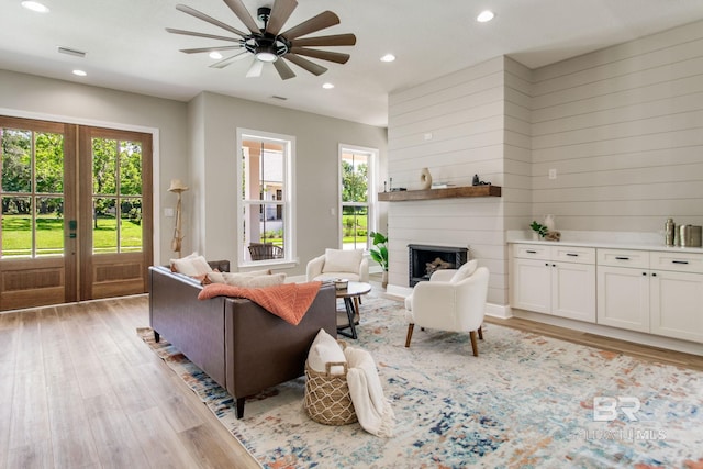 15132 Itea Dr, Foley, AL 36535 - living room featuring french doors, recessed lighting, light wood finished floors, ceiling fan, and a fireplace
