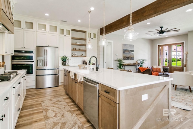 15132 Itea Dr, Foley, AL 36535 - kitchen featuring appliances with stainless steel finishes, open shelves, light wood-style flooring, recessed lighting, and decorative backsplash