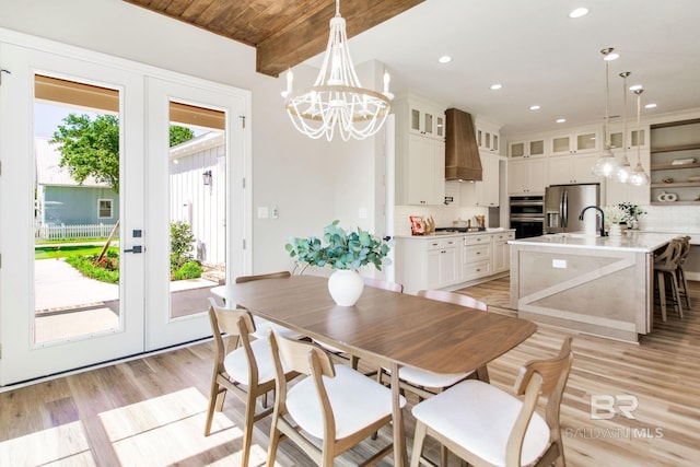 15132 Itea Dr, Foley, AL 36535 - dining room with light wood-type flooring, a chandelier, recessed lighting, and french doors