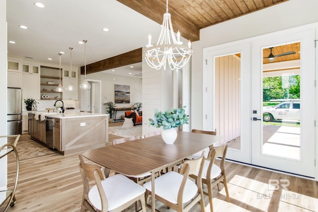 15132 Itea Dr, Foley, AL 36535 - dining space with light wood finished floors, recessed lighting, french doors, beam ceiling, and a chandelier