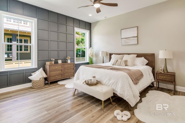 15132 Itea Dr, Foley, AL 36535 - bedroom featuring a decorative wall, wood finished floors, recessed lighting, and ceiling fan
