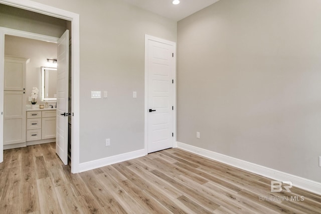 15132 Itea Dr, Foley, AL 36535 - unfurnished bedroom with light wood-style floors, recessed lighting, and connected bathroom