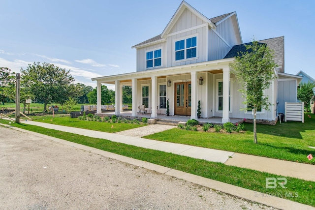 15132 Itea Dr, Foley, AL 36535 - modern farmhouse featuring board and batten siding, a porch, and a front yard
