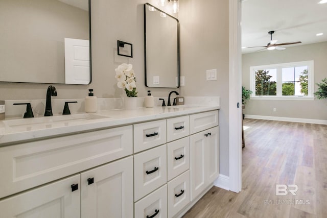 15132 Itea Dr, Foley, AL 36535 - full bathroom with double vanity, a ceiling fan, wood finished floors, and recessed lighting
