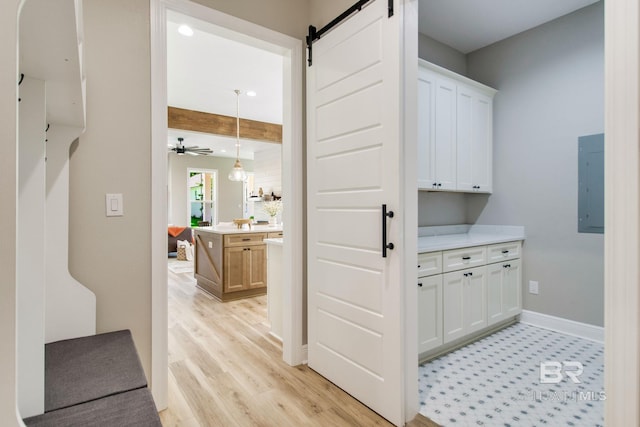 15132 Itea Dr, Foley, AL 36535 - hallway featuring a barn door, electric panel, light wood finished floors, and beamed ceiling